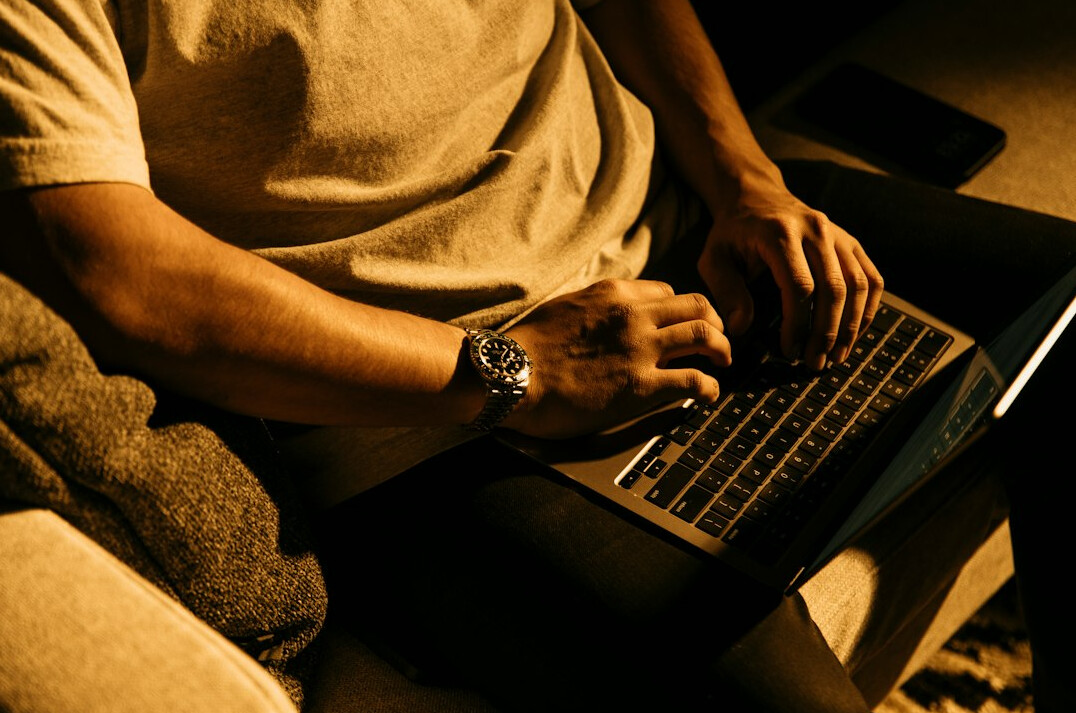 person using laptop at night